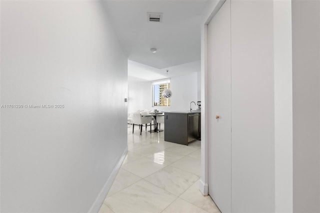 500 Brickell Ave Unit 2510, Miami, FL 33131 - hall with light tile patterned floors, visible vents, and baseboards
