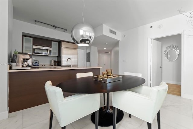 500 Brickell Ave Unit 2510, Miami, FL 33131 - dining area with visible vents, track lighting, and baseboards