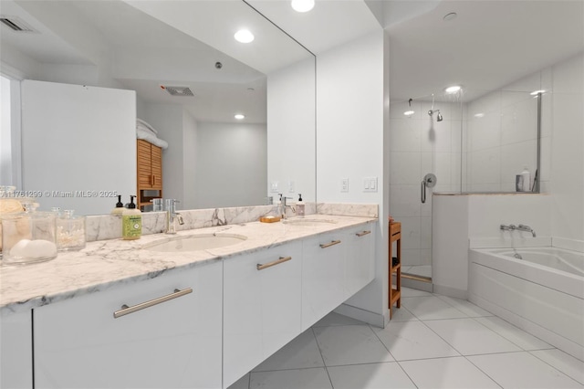500 Brickell Ave Unit 2510, Miami, FL 33131 - full bathroom featuring a bath, visible vents, a shower stall, and a sink