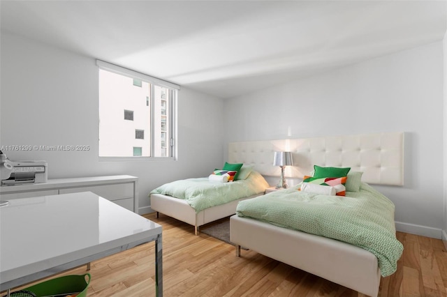 500 Brickell Ave Unit 2510, Miami, FL 33131 - bedroom with light wood-type flooring and baseboards