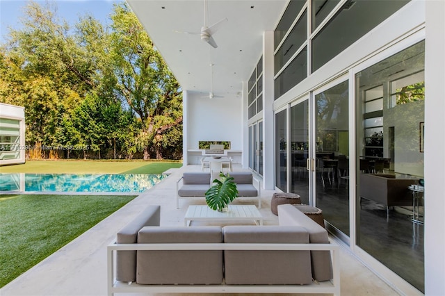 view of patio / terrace with an outdoor hangout area, french doors, and ceiling fan