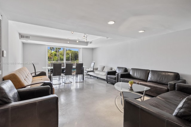 living room with recessed lighting, finished concrete flooring, and visible vents