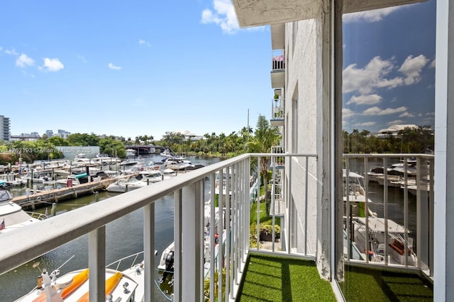 balcony featuring a water view