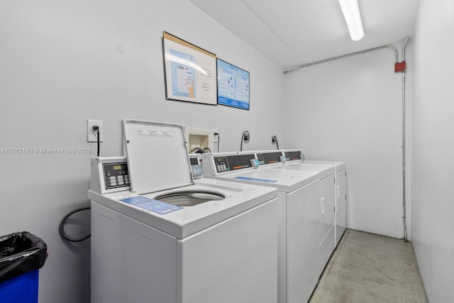 shared laundry area featuring washer and clothes dryer