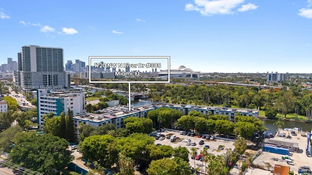 aerial view featuring a view of city and a water view