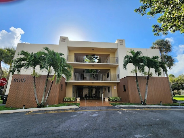 view of property with uncovered parking