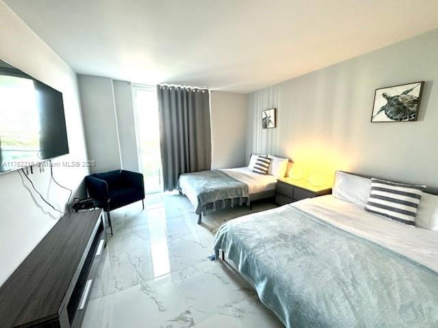 bedroom with marble finish floor