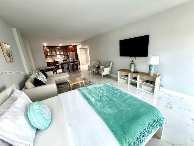 bedroom with baseboards and marble finish floor