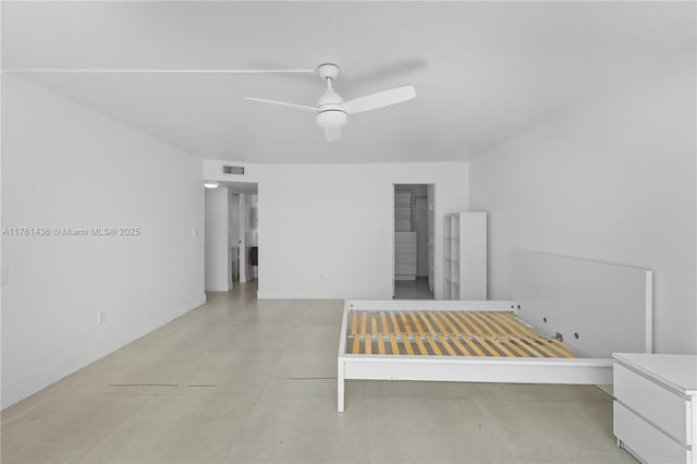 unfurnished bedroom featuring visible vents, baseboards, and ceiling fan