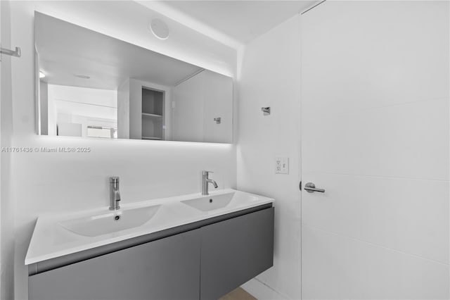 bathroom with double vanity and a sink