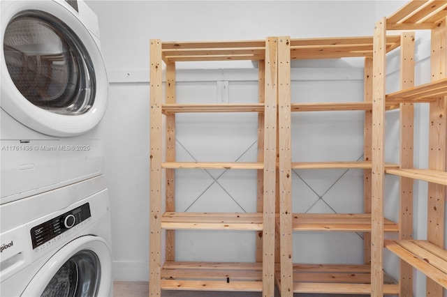 laundry area with laundry area and stacked washing maching and dryer