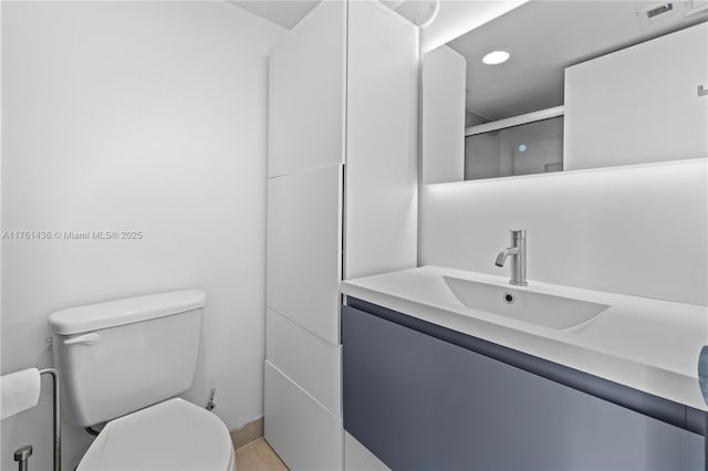 bathroom with vanity, visible vents, recessed lighting, an enclosed shower, and toilet