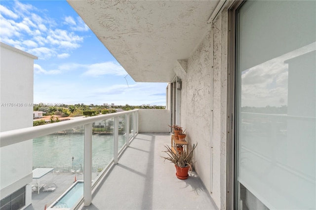 balcony featuring a water view