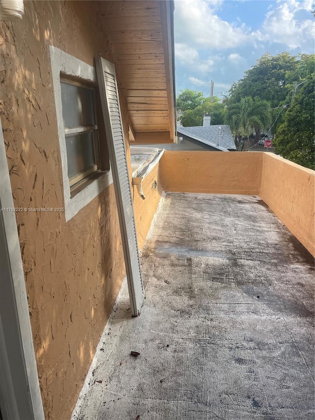 view of patio featuring a balcony