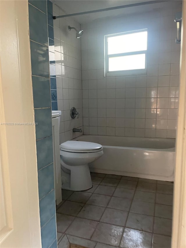 full bathroom with tile patterned floors, shower / tub combination, and toilet