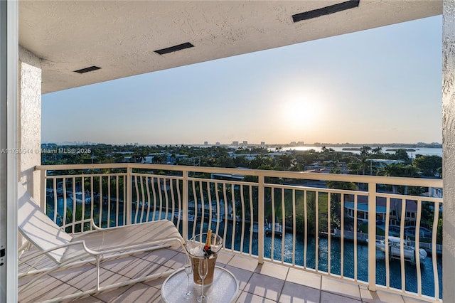 balcony at dusk with a view of city