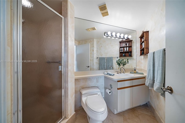 full bathroom featuring tile patterned floors, toilet, a stall shower, and vanity