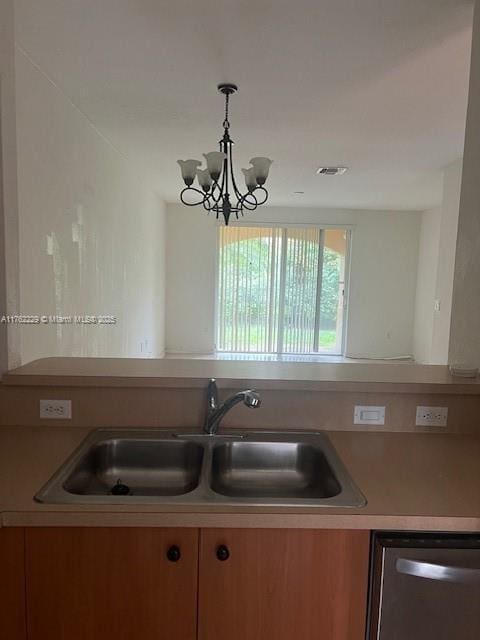 kitchen with visible vents, a notable chandelier, a sink, light countertops, and dishwasher