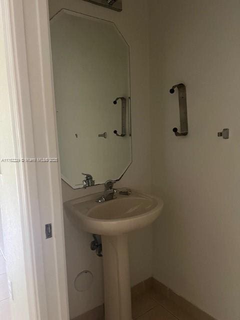 bathroom with tile patterned floors