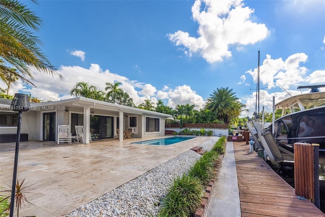 view of pool with a fenced in pool and a patio area