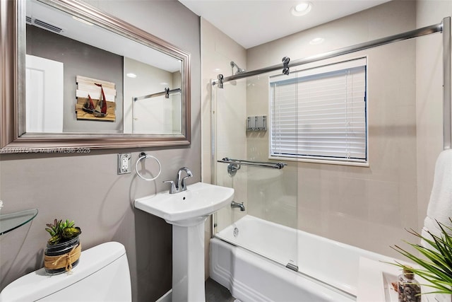 full bathroom with toilet, visible vents, recessed lighting, and shower / bath combination with glass door