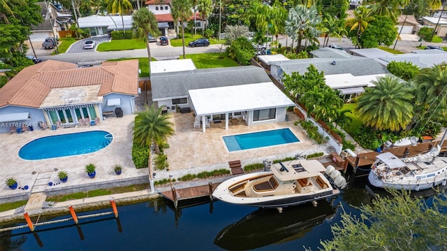 birds eye view of property with a residential view