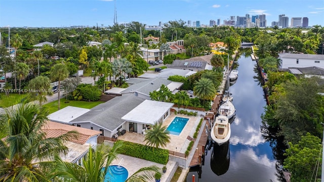 bird's eye view featuring a water view and a city view