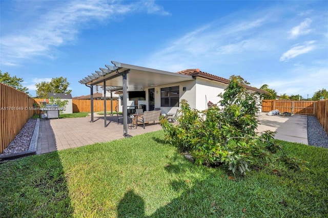 back of house with a tiled roof, a fenced backyard, a pergola, and a patio area