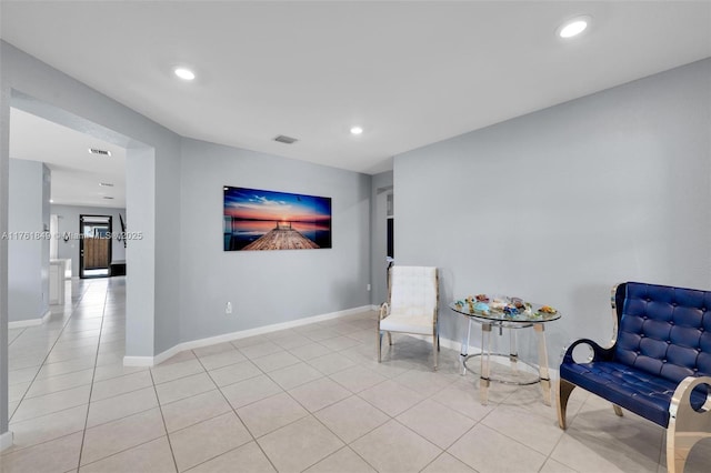 sitting room featuring tile patterned flooring, recessed lighting, baseboards, and visible vents