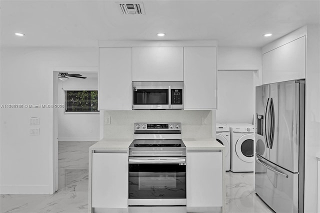 kitchen with visible vents, marble finish floor, independent washer and dryer, stainless steel appliances, and light countertops