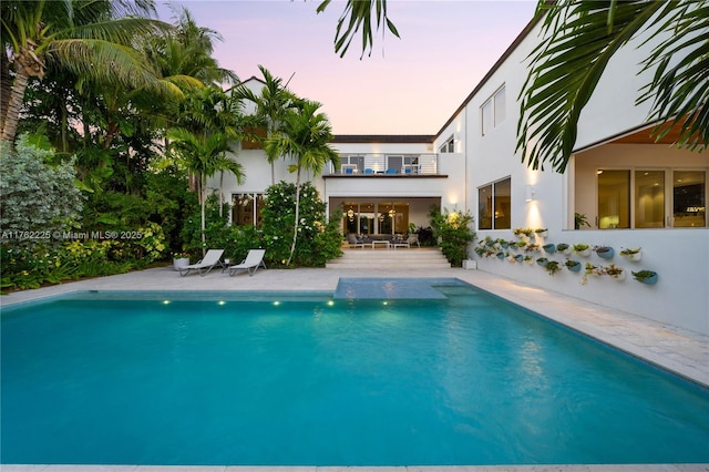 outdoor pool featuring a patio