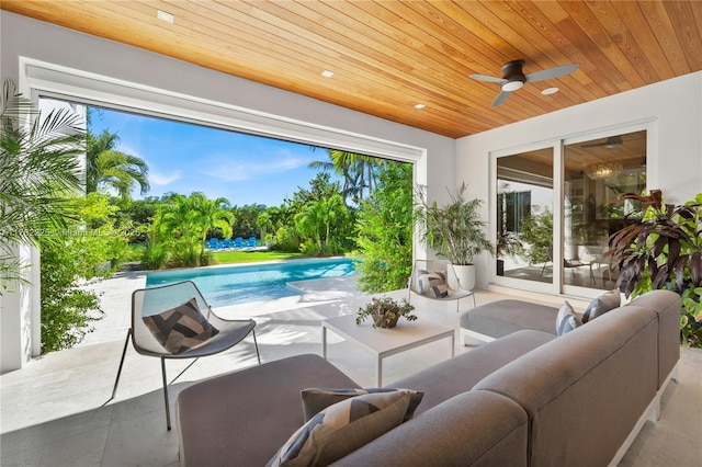 view of patio with an outdoor pool, an outdoor hangout area, and ceiling fan