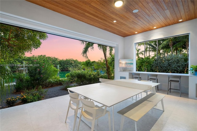 patio terrace at dusk with outdoor dining space