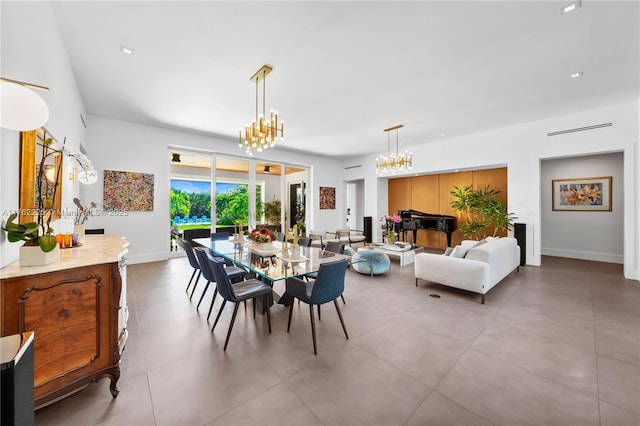 dining area with baseboards and a chandelier