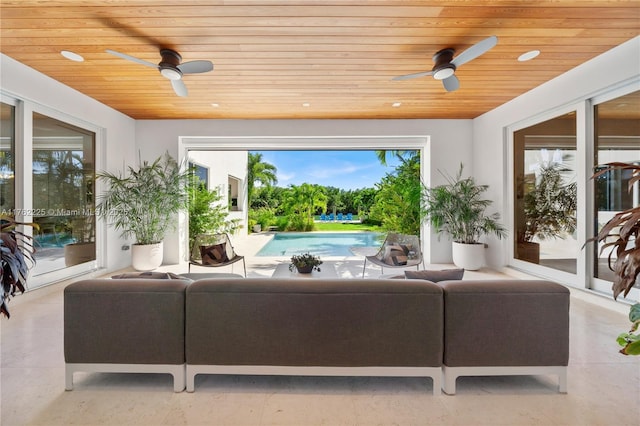 living room with wood ceiling and ceiling fan