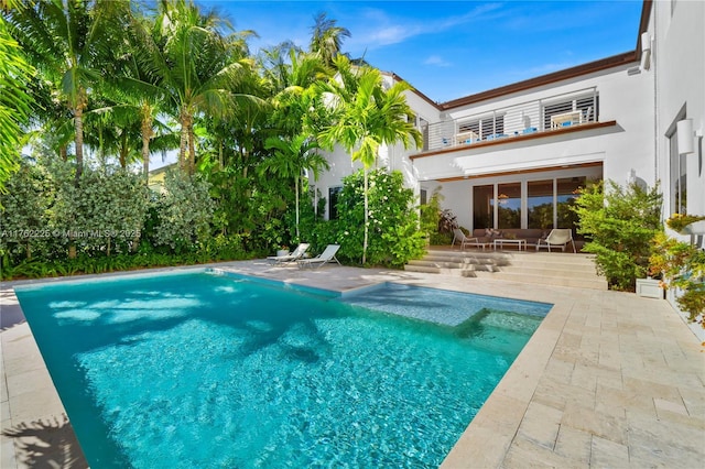 outdoor pool featuring a patio area