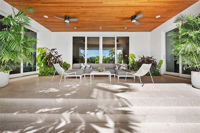 view of patio with an outdoor hangout area and a ceiling fan