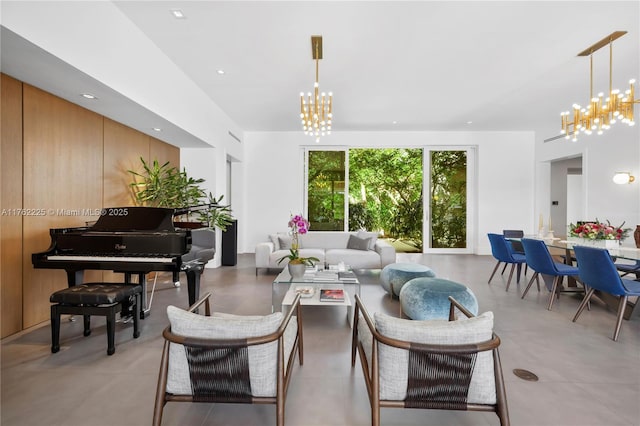 living area with an inviting chandelier and recessed lighting