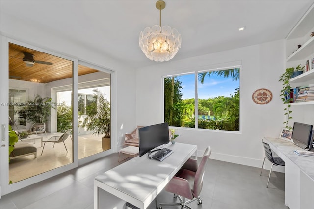 office space with a ceiling fan, baseboards, and a wealth of natural light