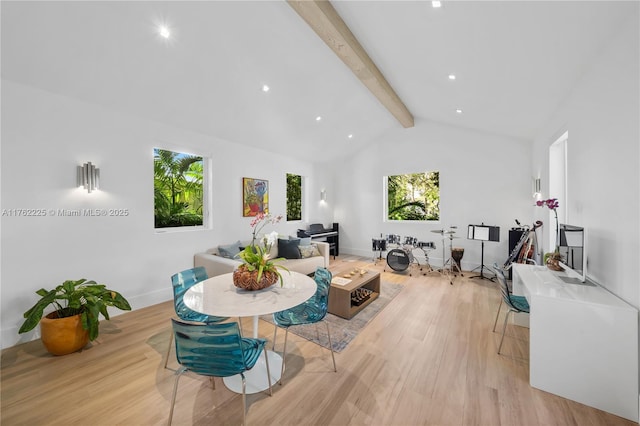 dining room with lofted ceiling with beams, recessed lighting, baseboards, and light wood finished floors