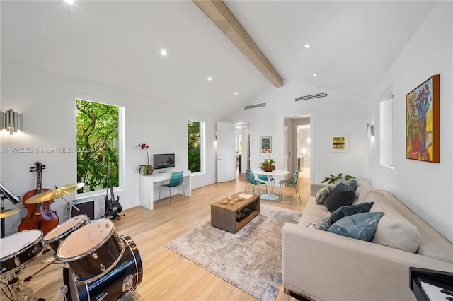 living area featuring beam ceiling, wood finished floors, visible vents, and high vaulted ceiling