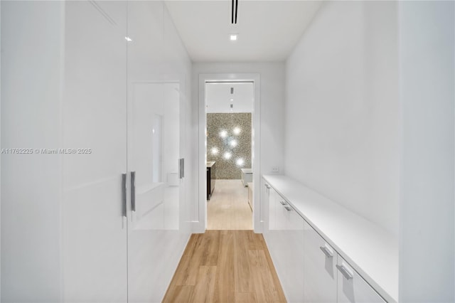 hallway featuring light wood-style flooring