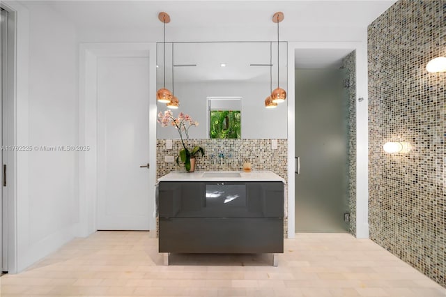 bathroom with backsplash and vanity