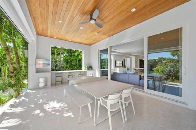 view of patio / terrace with outdoor dining area and ceiling fan