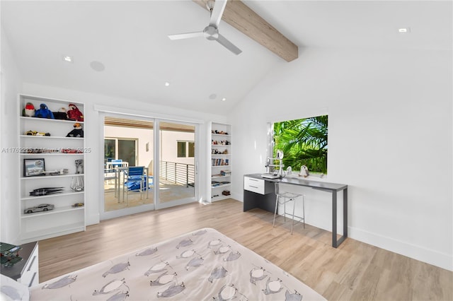 office space featuring ceiling fan, baseboards, lofted ceiling with beams, and light wood-style floors