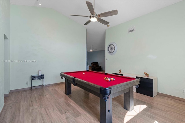 rec room featuring light wood-type flooring, visible vents, pool table, ceiling fan, and vaulted ceiling