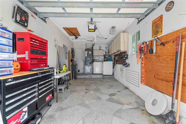 garage with a workshop area and a garage door opener