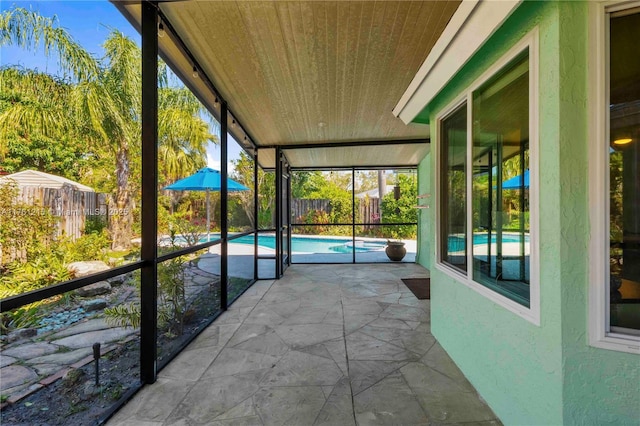 unfurnished sunroom featuring wooden ceiling