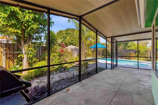 unfurnished sunroom with wooden ceiling