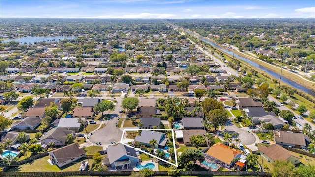 bird's eye view with a residential view and a water view